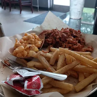 Fries, macaroni and cheese and pulled chicken