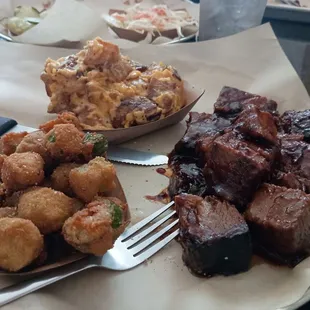 Burnt ends, fried okra and something that combined meat, cheese and potatoes