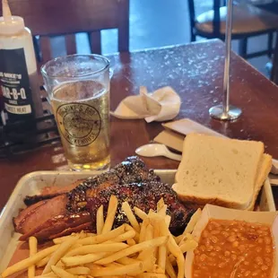 Full meal Kev piggin out three meat combo Baby back ribs little extra, sliced brisket, sausage, Fries baked beans Coors Lite 3/30/24