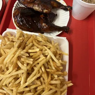 a plate of chicken and fries