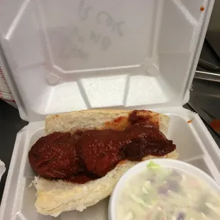 Meatball sandwich on a 6 in roll and cole slaw.