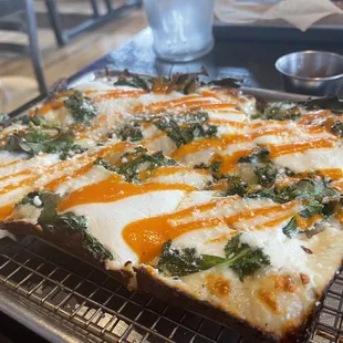 Cheese and greens pizza