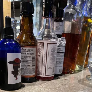 a variety of liquor bottles on a bar counter