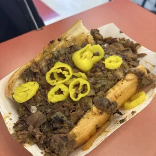 Regular Cheesesteak with cheese wiz, mushrooms, onions, peppers, and banana peppers.