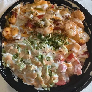 Shrimp Sizzle Rice Bowl with salad in it