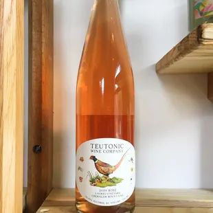 a bottle of wine on a shelf