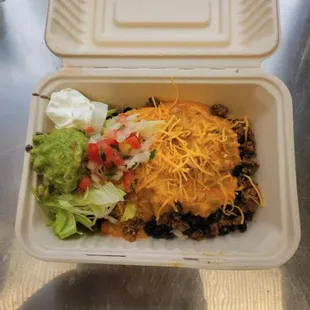 a meal in a styrofoam container