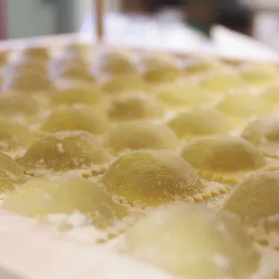 a lot of doughnuts in a pan