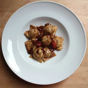 a plate of food on a wooden table