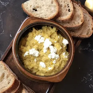 Humita. I guess I would say it's corn hummus with goat cheese and peppers. And bread.