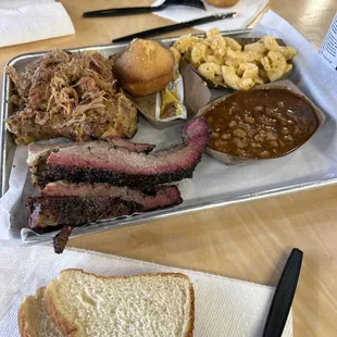 Trio - Pulled pork, brisket, chicken Sides -Baked beans, Mac and cheese