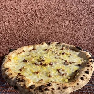 a pizza on a wire rack