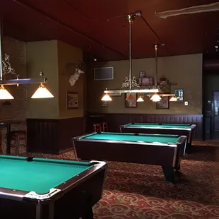 pool tables and a fireplace
