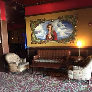 a painting of a woman on the wall