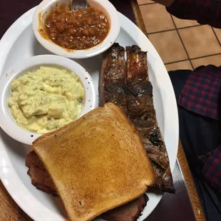 Two meat platter, ribs, brisket, pot salad and beans, toast.