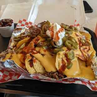 Loaded BBQ brisket Nachos. Side of BBQ beans.