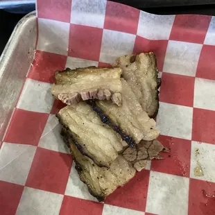 Excess fat from brisket sandwich