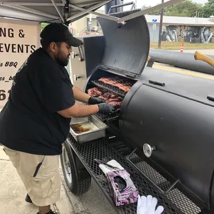 a man grilling meat