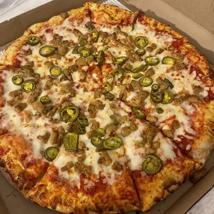 Large pizza with jalapeños and sausage