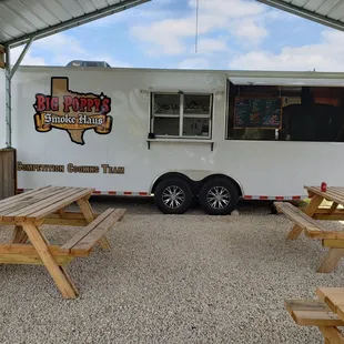 picnic tables and a food truck
