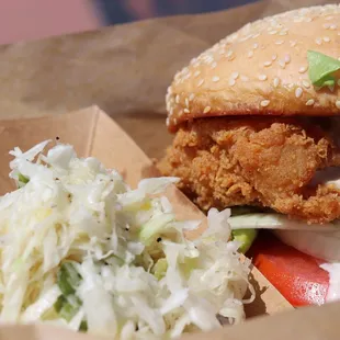 a chicken sandwich and coleslaw