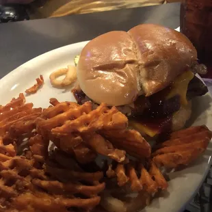 Brisket sandwich with waffle fries.