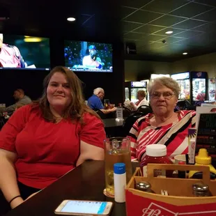 two women sitting at a table