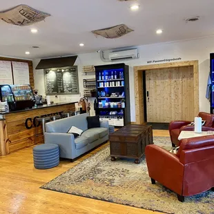 a bar, couches, and a coffee shop
