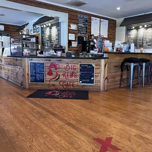 a wooden counter with a menu on it