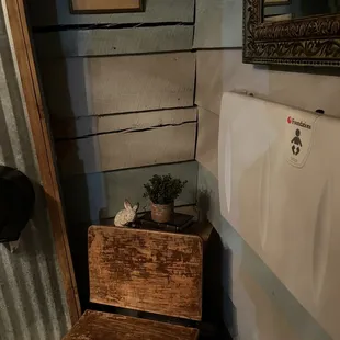 a wooden bench in a bathroom