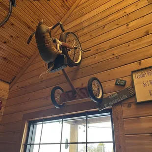 a stuffed bear on a bike