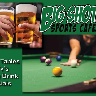 a pool table with two glasses of beer