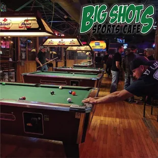a man playing pool