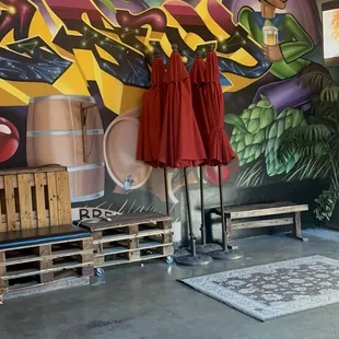 Dance floor close to the warehouse door, beautiful wooden furniture, table tops, comfortable benches and plenty of room to dance.