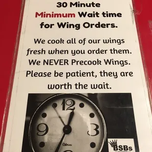 a sign with a clock
