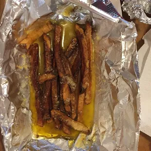 Fries drowning in butter. Eww