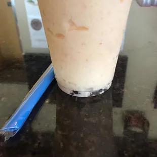 milkshake with whipped cream and a straw