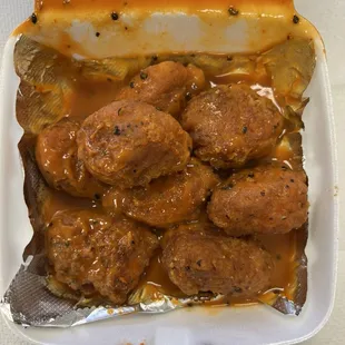 meatballs in gravy in a styrofoam container