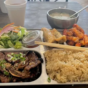 Shortrib meal box with spicy rice cakes and veggie dumplings