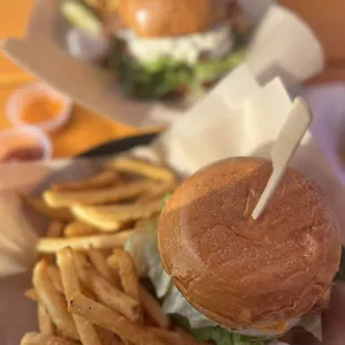 Cheeseburger and Blue Cheese Bacon Burger in the back.