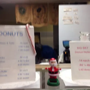 a menu and a santa figurine