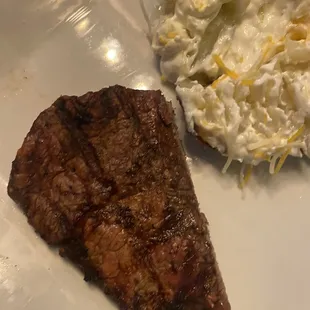 a piece of steak and whipped cream