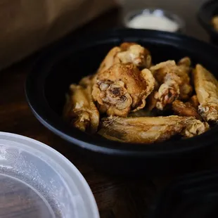 a bowl of chicken wings