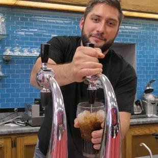 a man pouring a drink