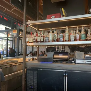 a man behind the bar at a restaurant