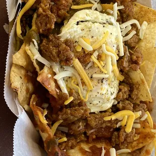 Chilaquiles with red and green chili, chorizo, and an egg