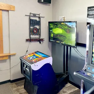 an arcade machine and a tv