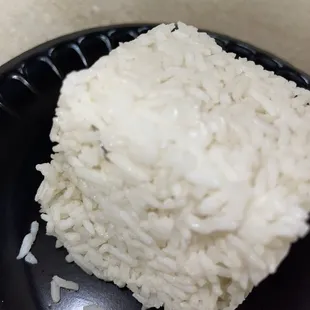 Don't act like you don't see the sliver of something or metal EMBEDDED in that rice