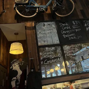 a bicycle parked in front of a restaurant