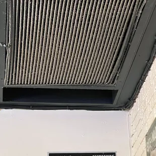Air return vents covered with plenty of dust